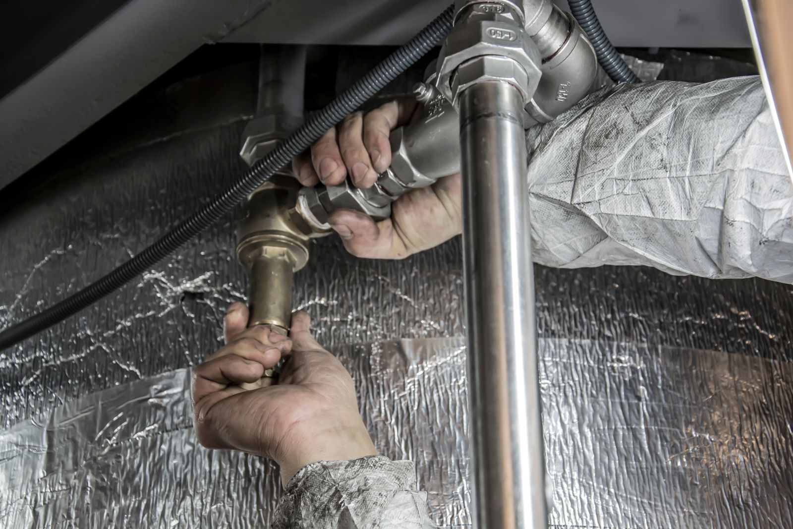 A licensed trade completing a repair at a managed Phoenix rental